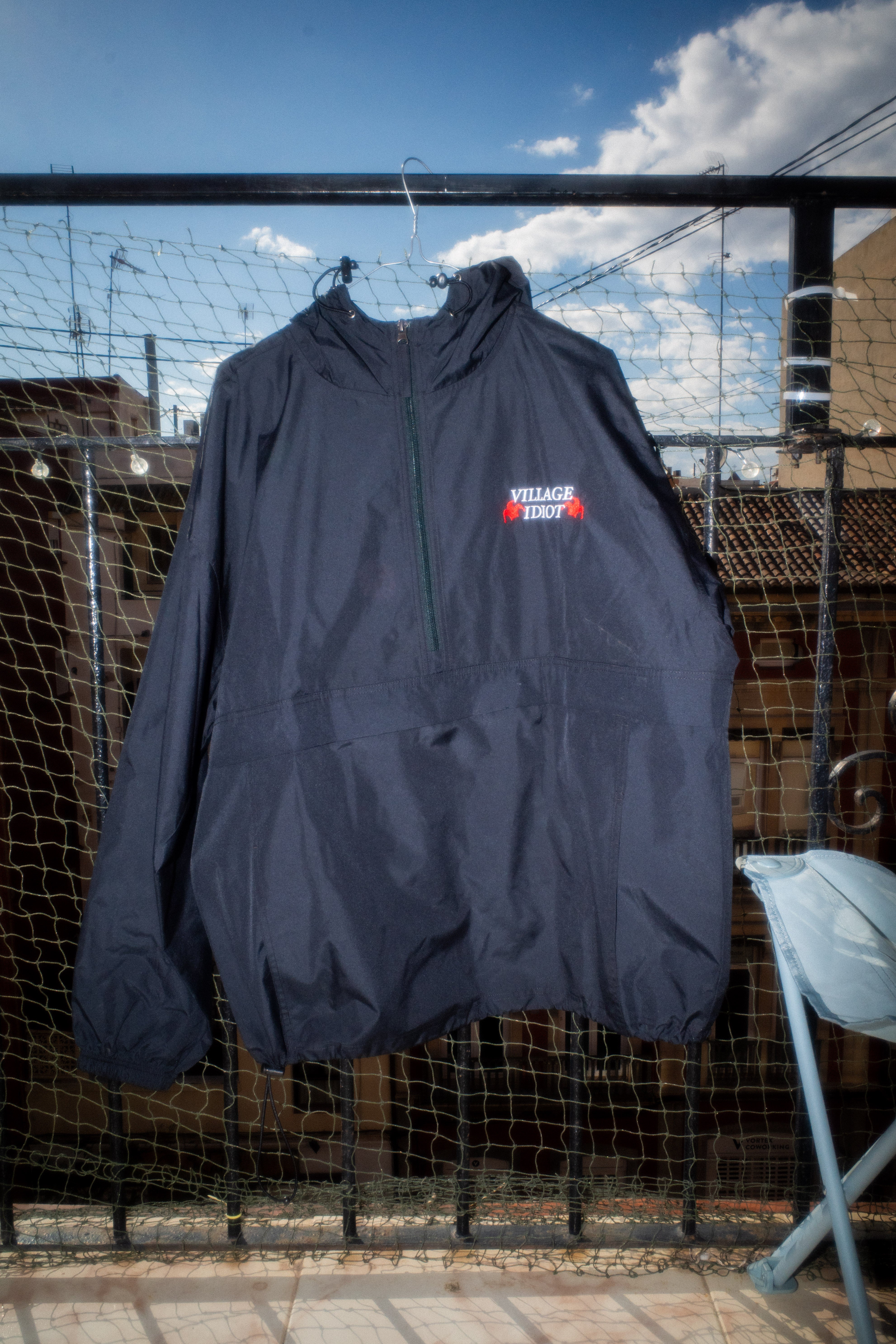 village idiot – embroidered packable jacket – dogecore