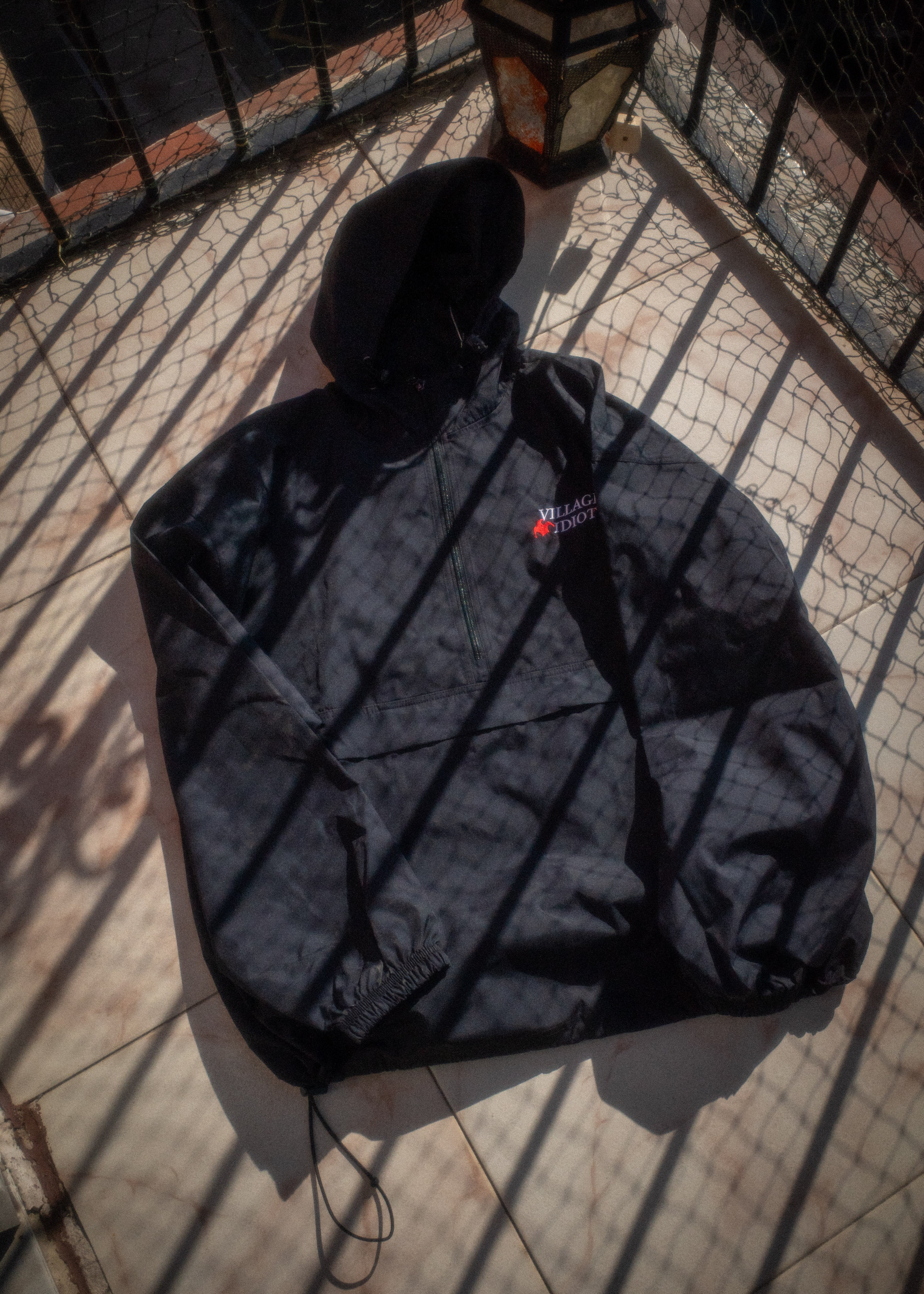 village idiot – embroidered packable jacket – dogecore